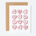 Card with red heart-shaped words on a white background